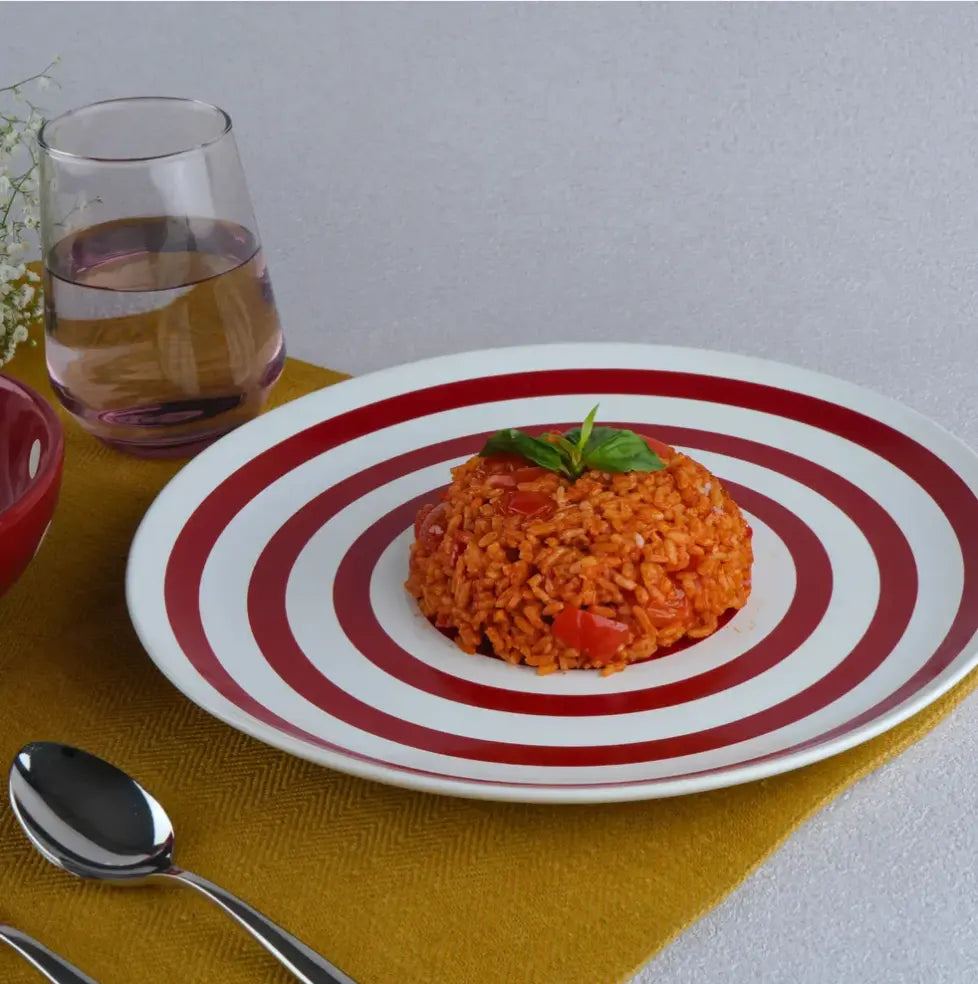 Elegant dining table styled with BlackCarrot ceramic dinner plates and cutlery in a formal setting