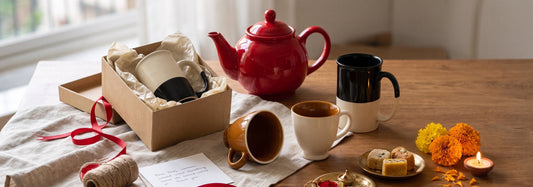 Black Carrot Bhai Dooj gifts to send a sibling far away — coffee mugs, tea cups, and a red teapot