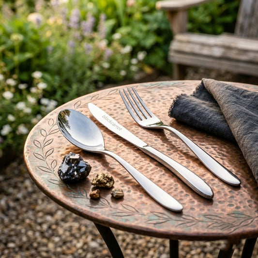 Modern BlackCarrot cutlery set with sleek stainless steel spoon, fork, and knife displayed in a clean, premium arrangement